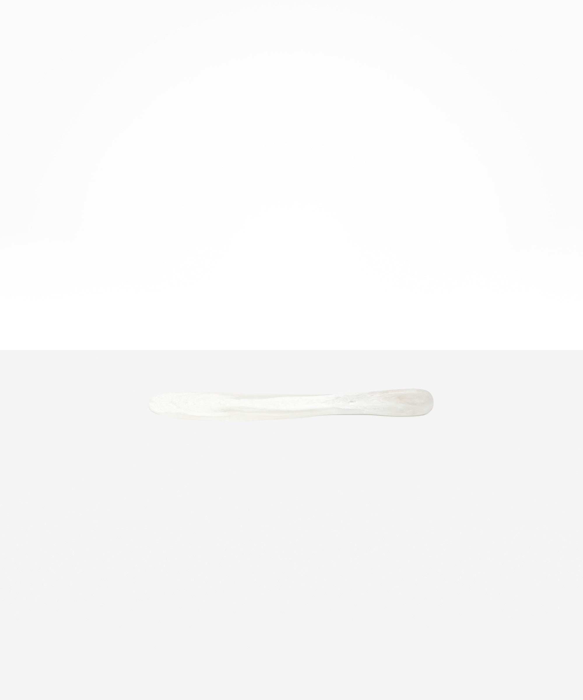 Dinosaur Designs Temple Cake Knife in Snow Swirl — handcrafted marbled white and clear resin cake knife with smooth tapered blade and rounded handle