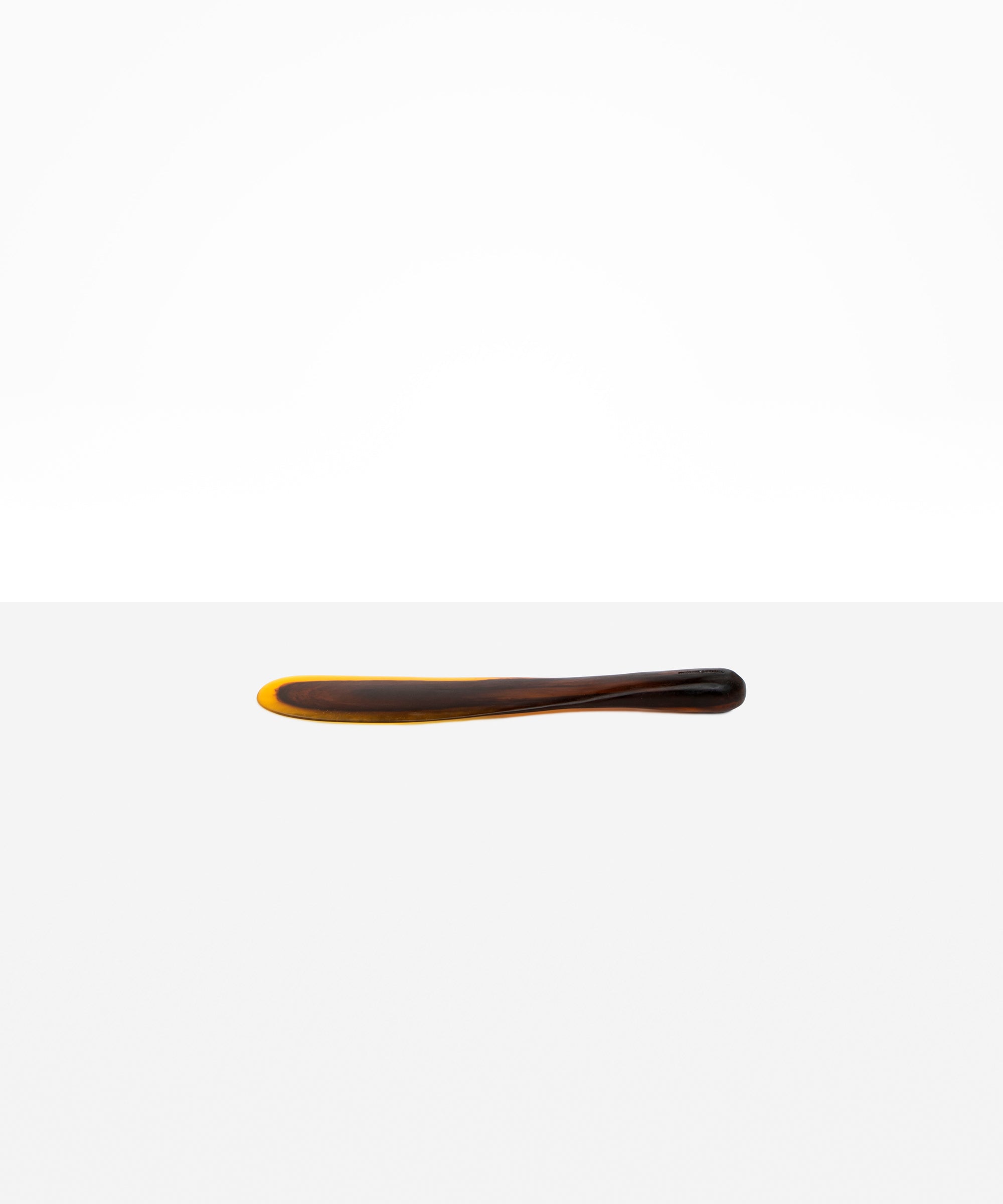Dinosaur Designs Temple Cake Knife in Tortoise — handcrafted marbled amber and black resin cake knife with smooth tapered blade and rounded handle