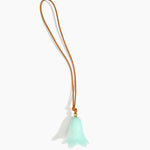 Dinosaur Designs Flower Bag Charm in Mint colour with Brass bead — handcrafted marbled mint blue resin bell-shaped flower bag charm with tan leather hanging loop and brass bead