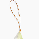 Dinosaur Designs Flower Bag Charm in Pistachio colour with Brass bead — handcrafted marbled pastel green resin bell-shaped flower bag charm with tan leather hanging loop and brass bead