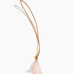 Dinosaur Designs Flower Bag Charm in Rose Swirl colour with Brass bead — handcrafted marbled dusty pink resin bell-shaped flower bag charm with tan leather hanging loop and brass bead