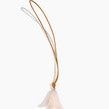 Dinosaur Designs Flower Bag Charm in Rose Swirl colour with Brass bead — handcrafted marbled dusty pink resin bell-shaped flower bag charm with tan leather hanging loop and brass bead