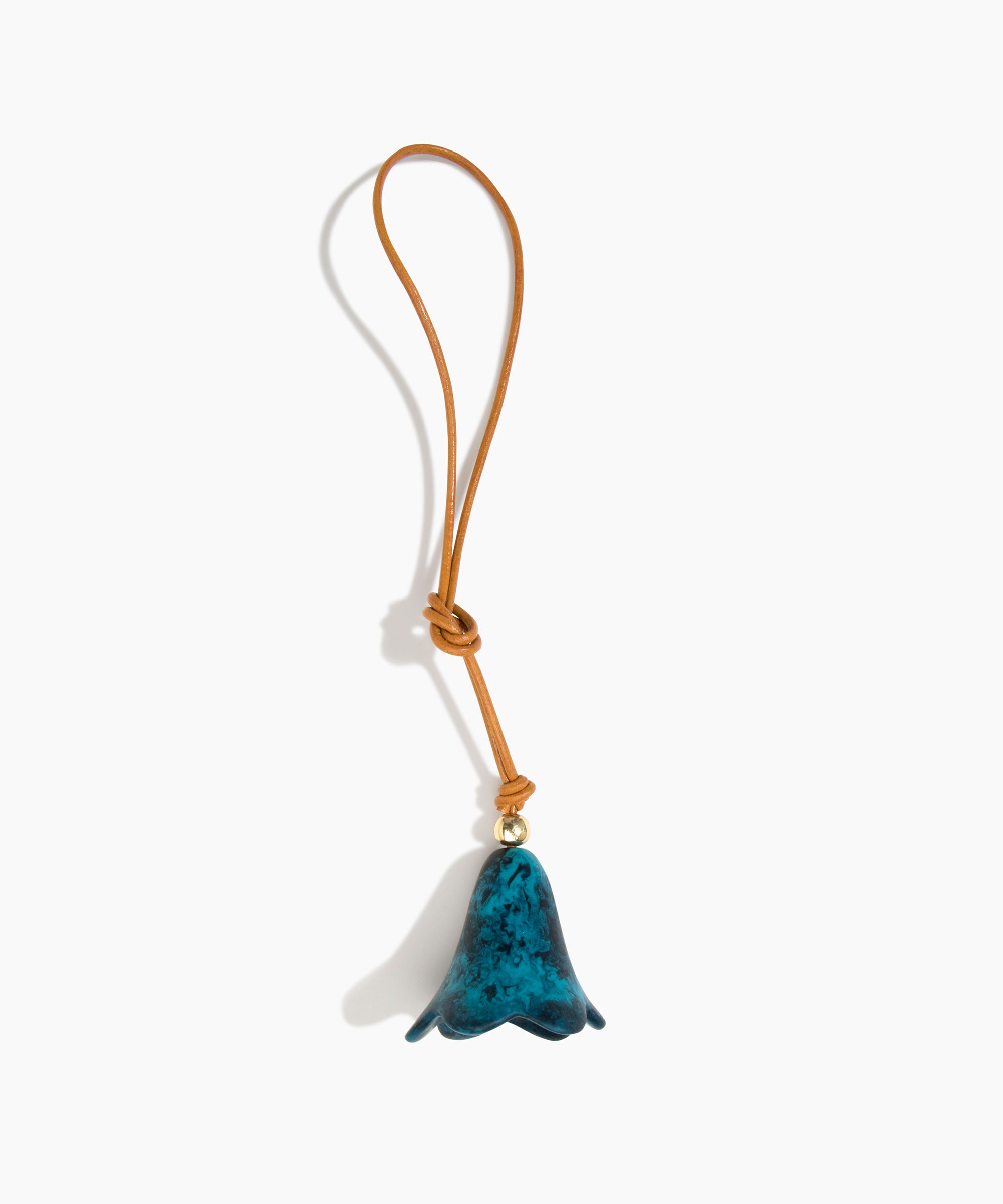 Dinosaur Designs Flower Bag Charm in Turquoise colour with Brass bead — handcrafted marbled teal blue resin bell-shaped flower bag charm with tan leather hanging loop and brass bead