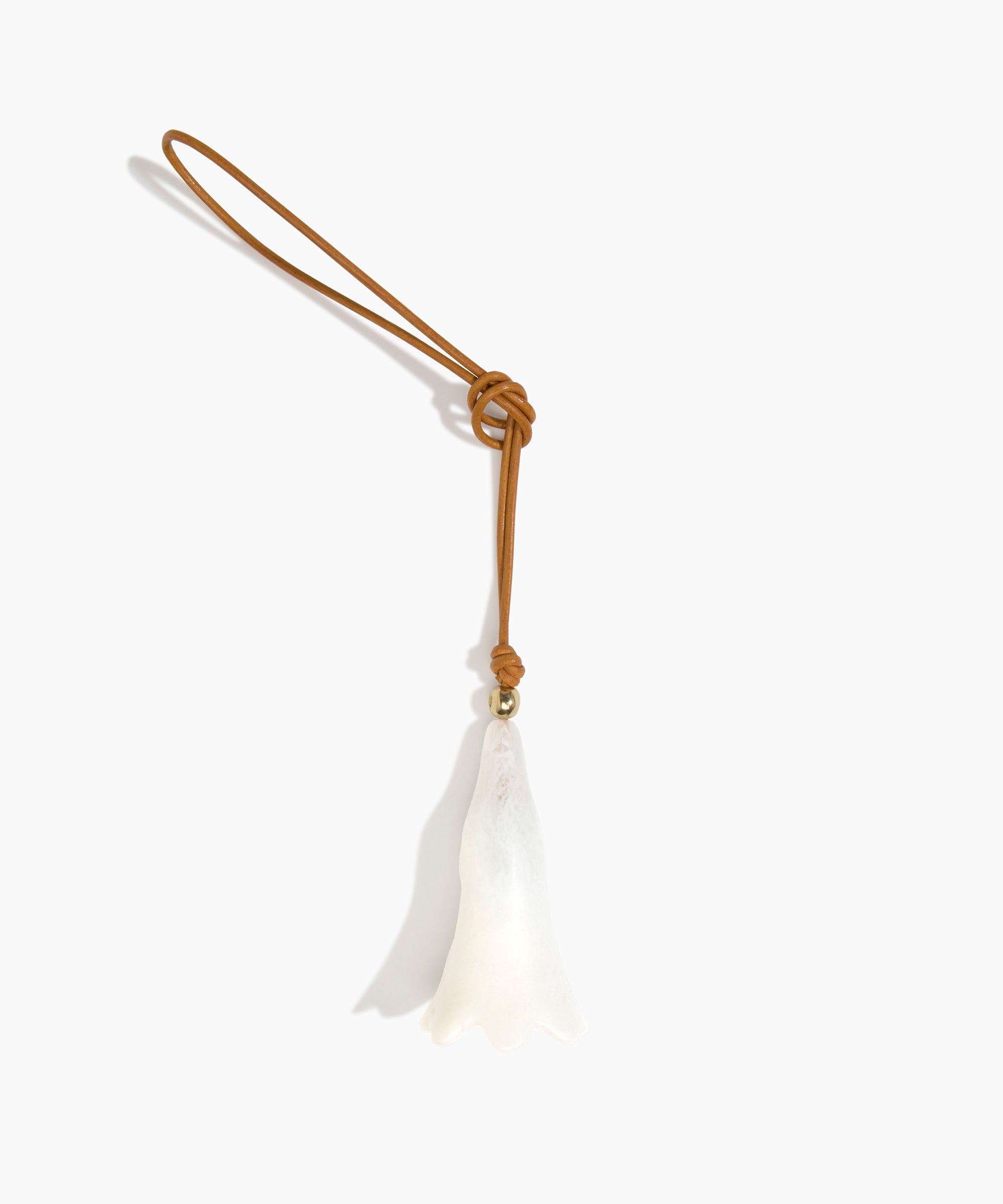 Dinosaur Designs Long Flower Bag Charm in Chalk Swirl colour with Brass bead — handcrafted marbled off-white resin bell-shaped flower bag charm with tan leather hanging loop and brass bead