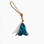 Dinosaur Designs Flower Decoration in Turquoise colour with Brass bead — handcrafted marbled teal blue resin bell-shaped flower ornament with tan leather hanging loop and brass bead
