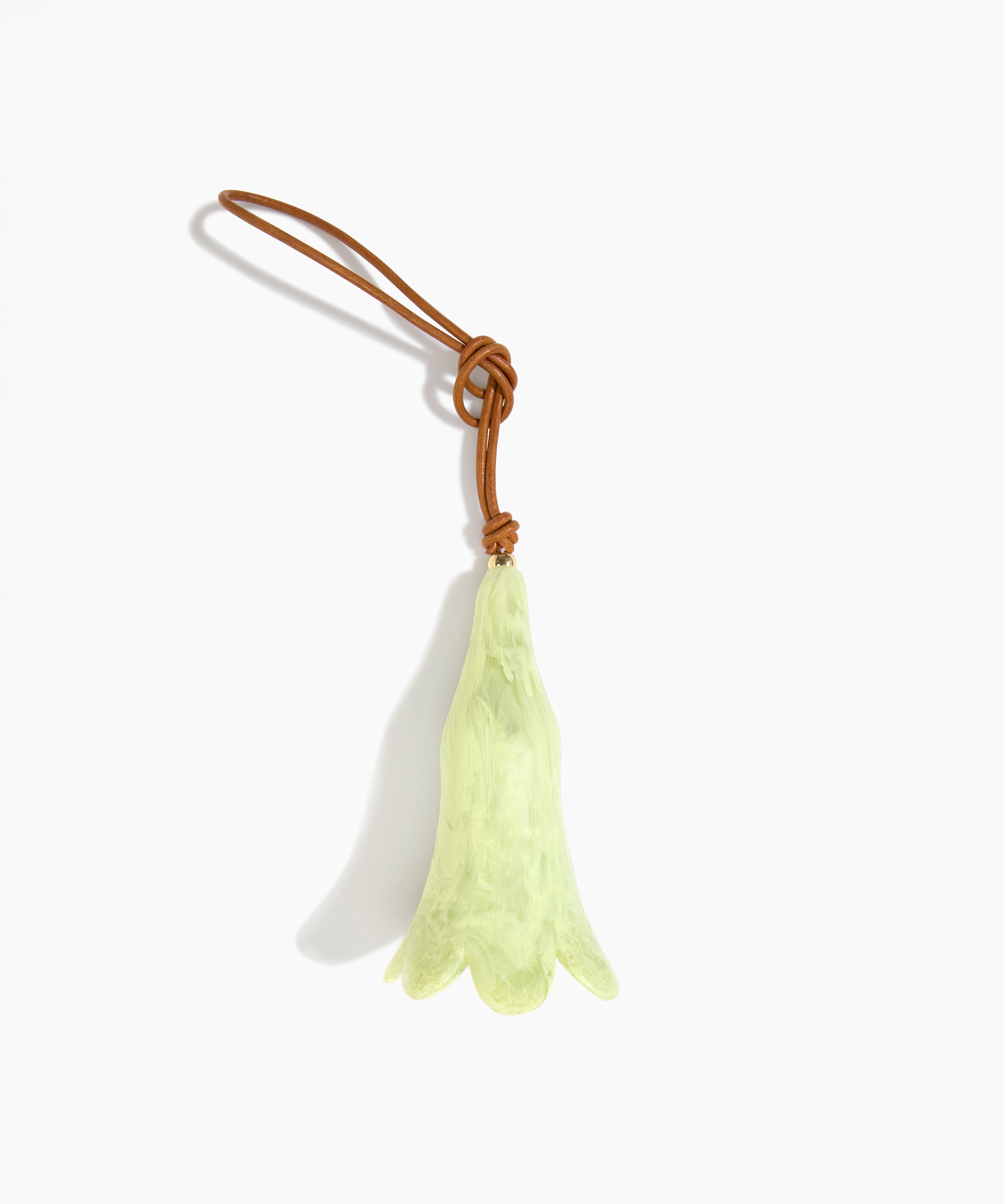 Dinosaur Designs Long Flower Decoration in Pistachio colour with Brass bead — handcrafted marbled pastel green resin bell-shaped flower ornament with tan leather hanging loop and brass bead