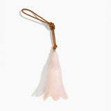 Dinosaur Designs Long Flower Decoration in Rose Swirl colour with Brass bead — handcrafted marbled dusty pink resin bell-shaped flower ornament with tan leather hanging loop and brass bead
