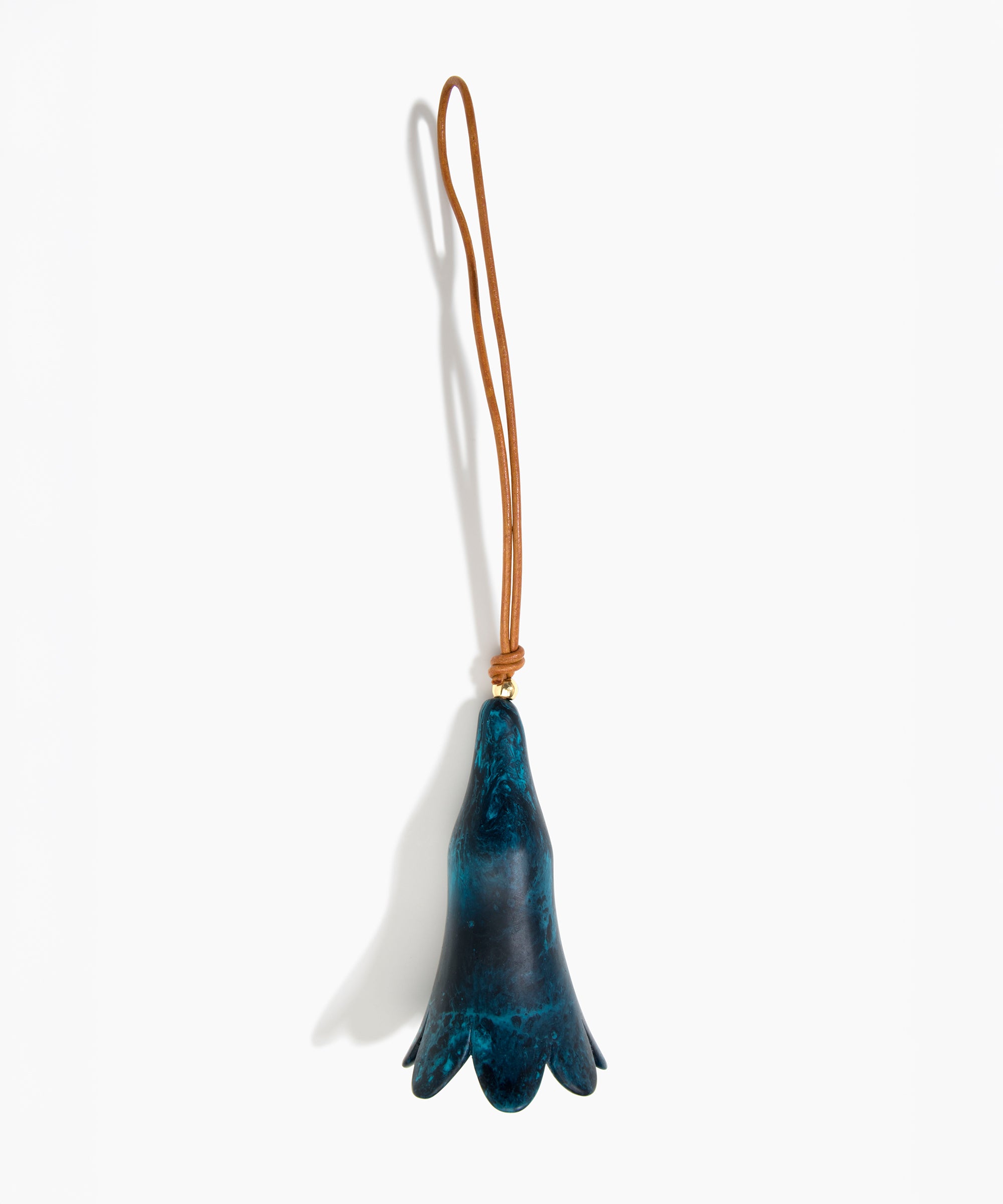 Dinosaur Designs Long Flower Decoration in Turquoise colour with Brass bead — handcrafted marbled teal blue resin bell-shaped flower ornament with tan leather hanging loop and brass bead