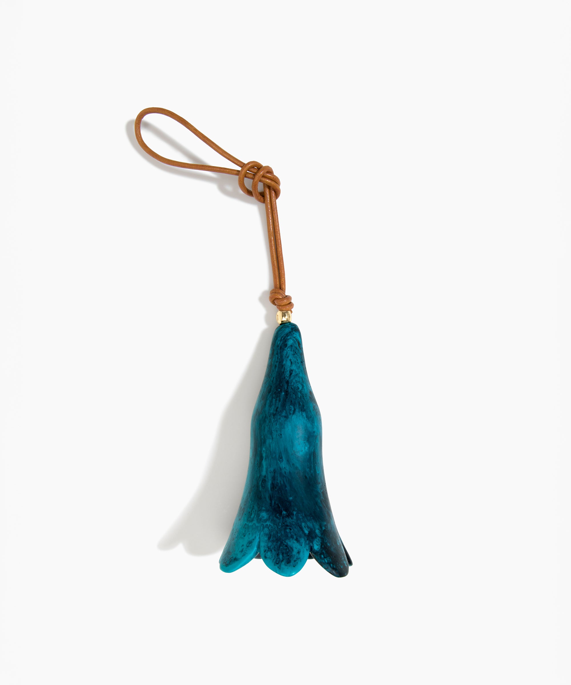 Dinosaur Designs Long Flower Decoration in Turquoise colour with Brass bead — handcrafted marbled teal blue resin bell-shaped flower ornament with tan leather hanging loop and brass bead