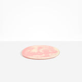 Dinosaur Designs Rock Plate in Blossom — handcrafted marbled pink and cream resin oval flat serving plate with rounded organic edge