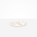 Dinosaur Designs Rock Plate in Pool — handcrafted marbled off-white resin oval flat serving plate with rounded organic edge