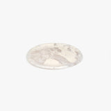 Dinosaur Designs Rock Plate in Pool — handcrafted marbled off-white resin oval flat serving plate with rounded organic edge