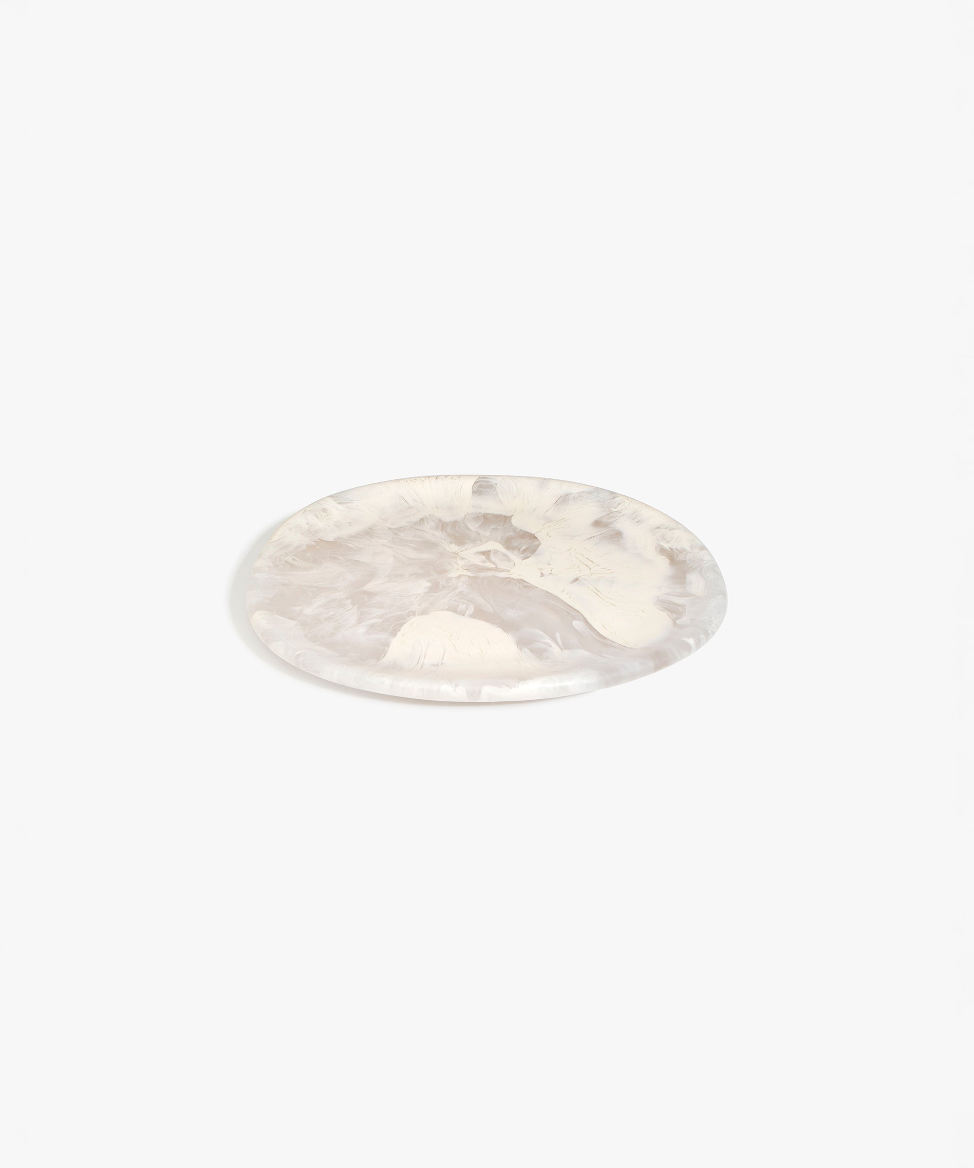 Dinosaur Designs Rock Plate in Pool — handcrafted marbled off-white resin oval flat serving plate with rounded organic edge