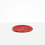 Dinosaur Designs Rock Plate in Cranberry — handcrafted marbled red resin oval flat serving plate with rounded organic edge