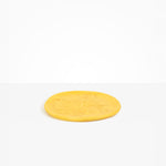 Dinosaur Designs Rock Plate in Pollen — handcrafted marbled yellow resin oval flat serving plate with rounded organic edge