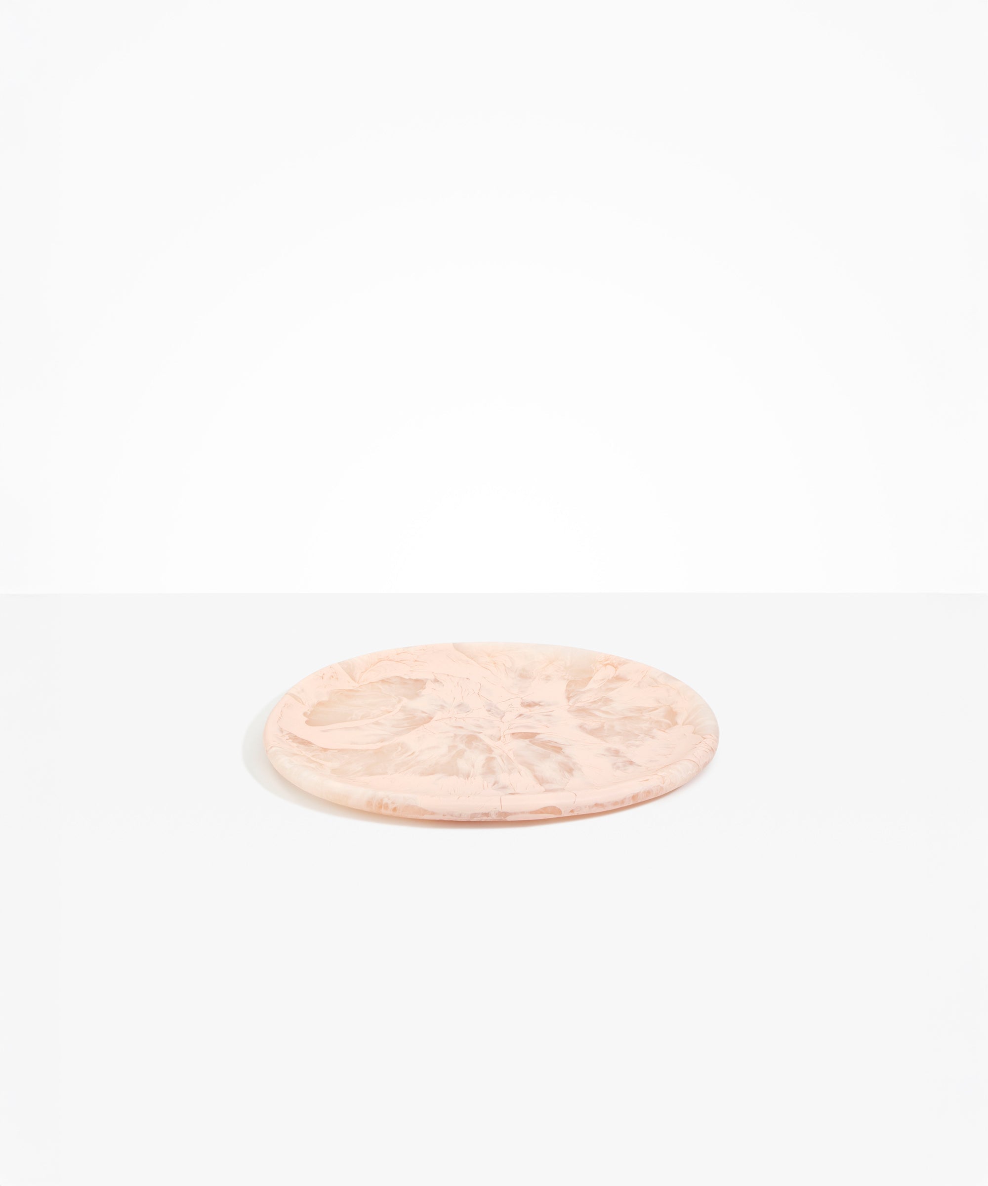 Dinosaur Designs Rock Plate in Rose Swirl — handcrafted marbled dusty pink resin oval flat serving plate with rounded organic edge