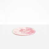 Dinosaur Designs Rock Plate in Shell Pink — handcrafted marbled pink resin oval flat serving plate with rounded organic edge