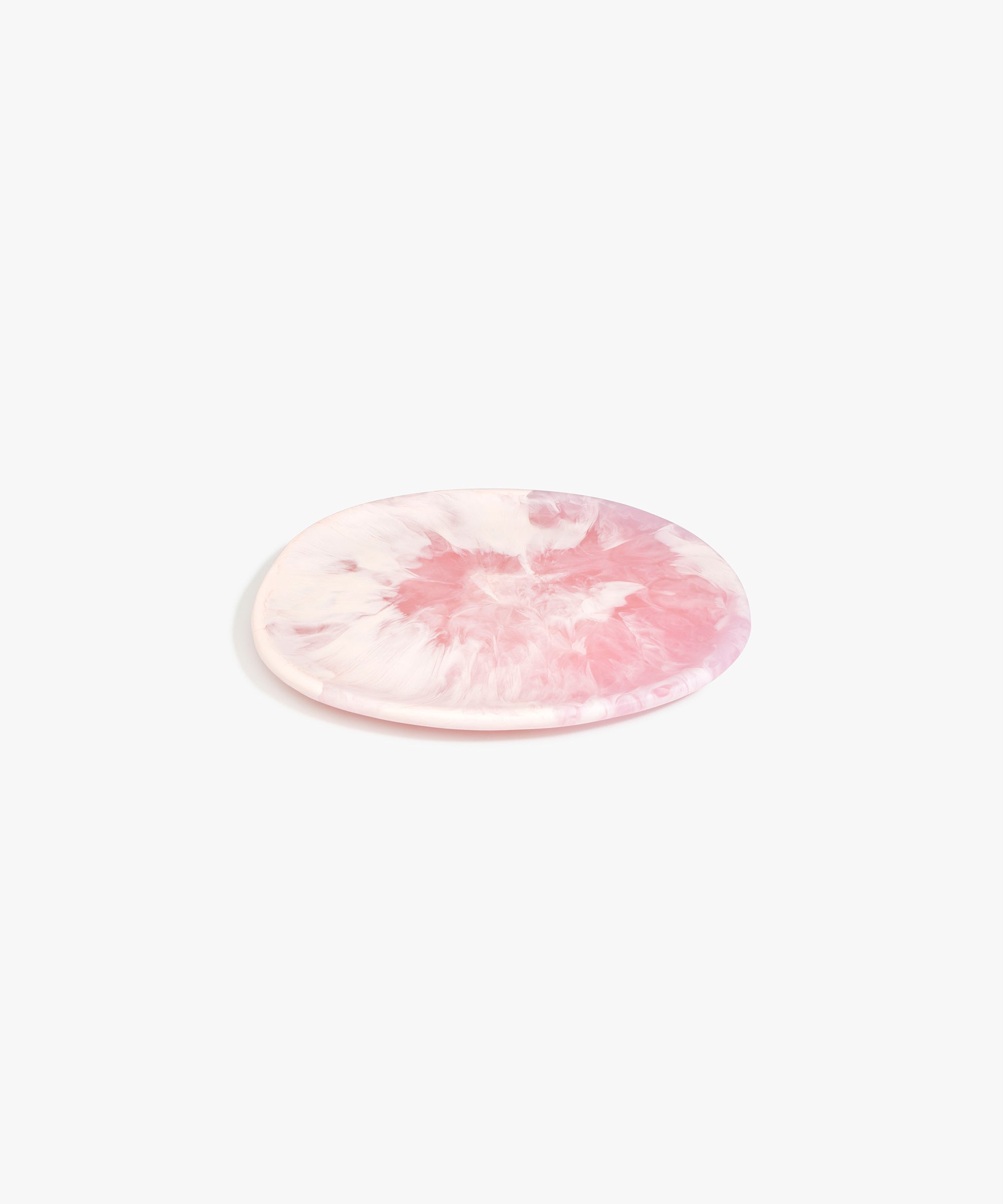 Dinosaur Designs Rock Plate in Shell Pink — handcrafted marbled pink resin oval flat serving plate with rounded organic edge