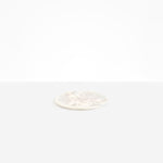 Dinosaur Designs Small Rock Plate in Chalk Swirl — handcrafted marbled off-white resin oval flat serving plate with rounded organic edge