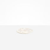 Dinosaur Designs Small Rock Plate in Chalk Swirl — handcrafted marbled off-white resin oval flat serving plate with rounded organic edge