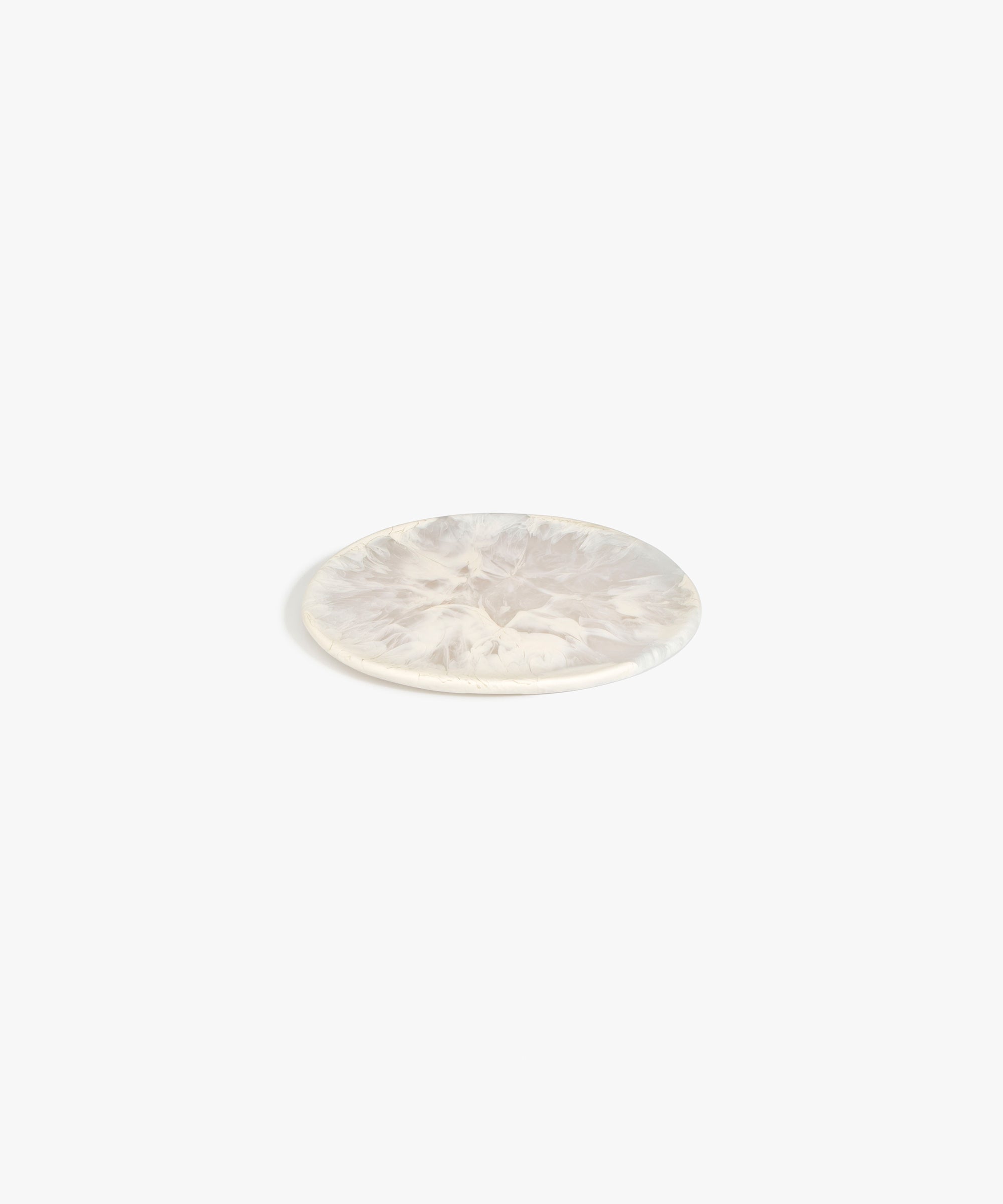 Dinosaur Designs Small Rock Plate in Chalk Swirl — handcrafted marbled off-white resin oval flat serving plate with rounded organic edge