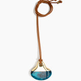Dinosaur Designs Large Polished Lotus Pendant on Leather in Turquoise with Brass hardware — marbled teal blue resin half-crescent pendant with polished brass setting on an adjustable tan leather cord