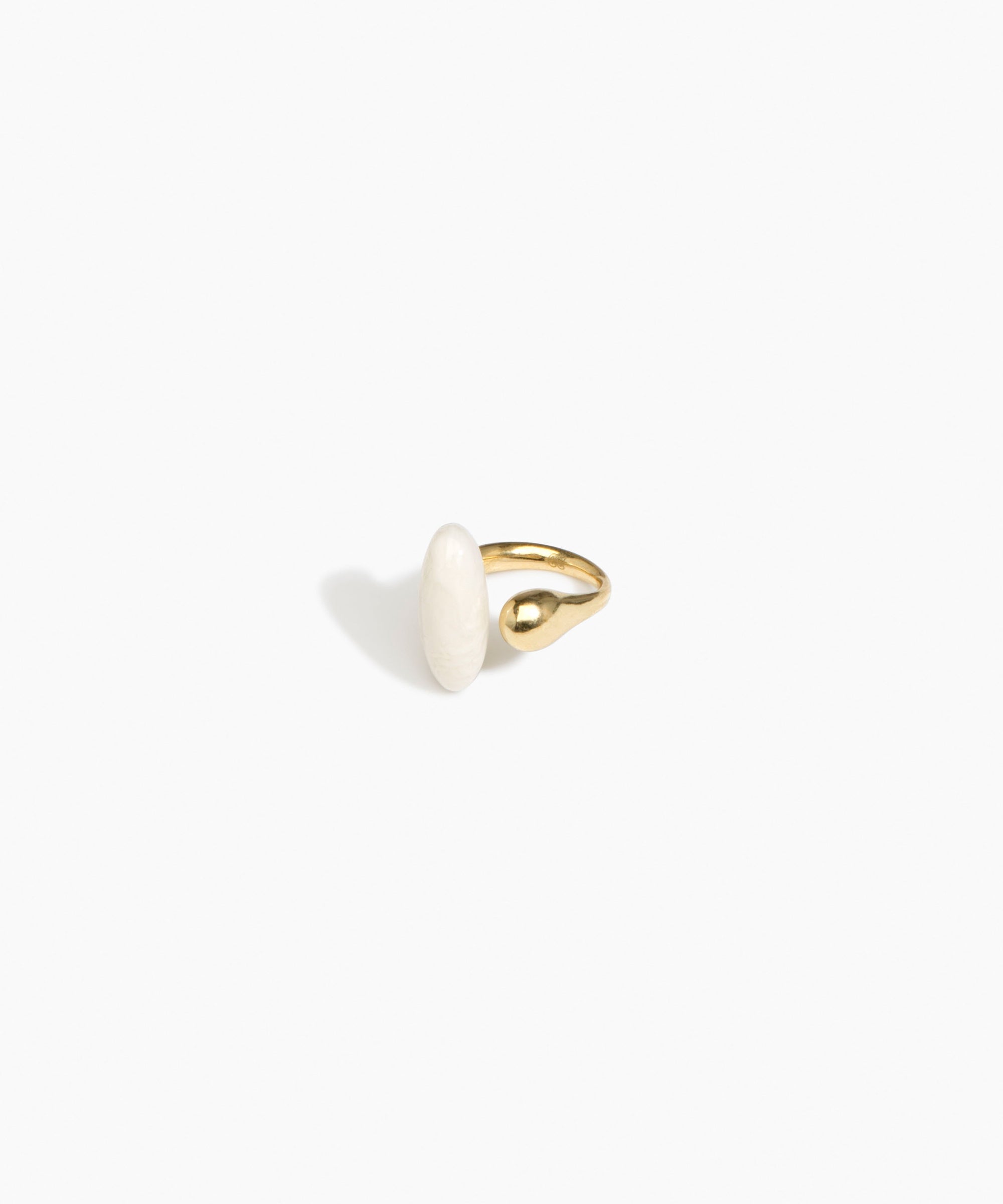 Dinosaur Designs Polished Lotus Ring in Chalk Swirl with Brass — marbled off-white resin elongated oval ring with  brass band and small brass ball detail