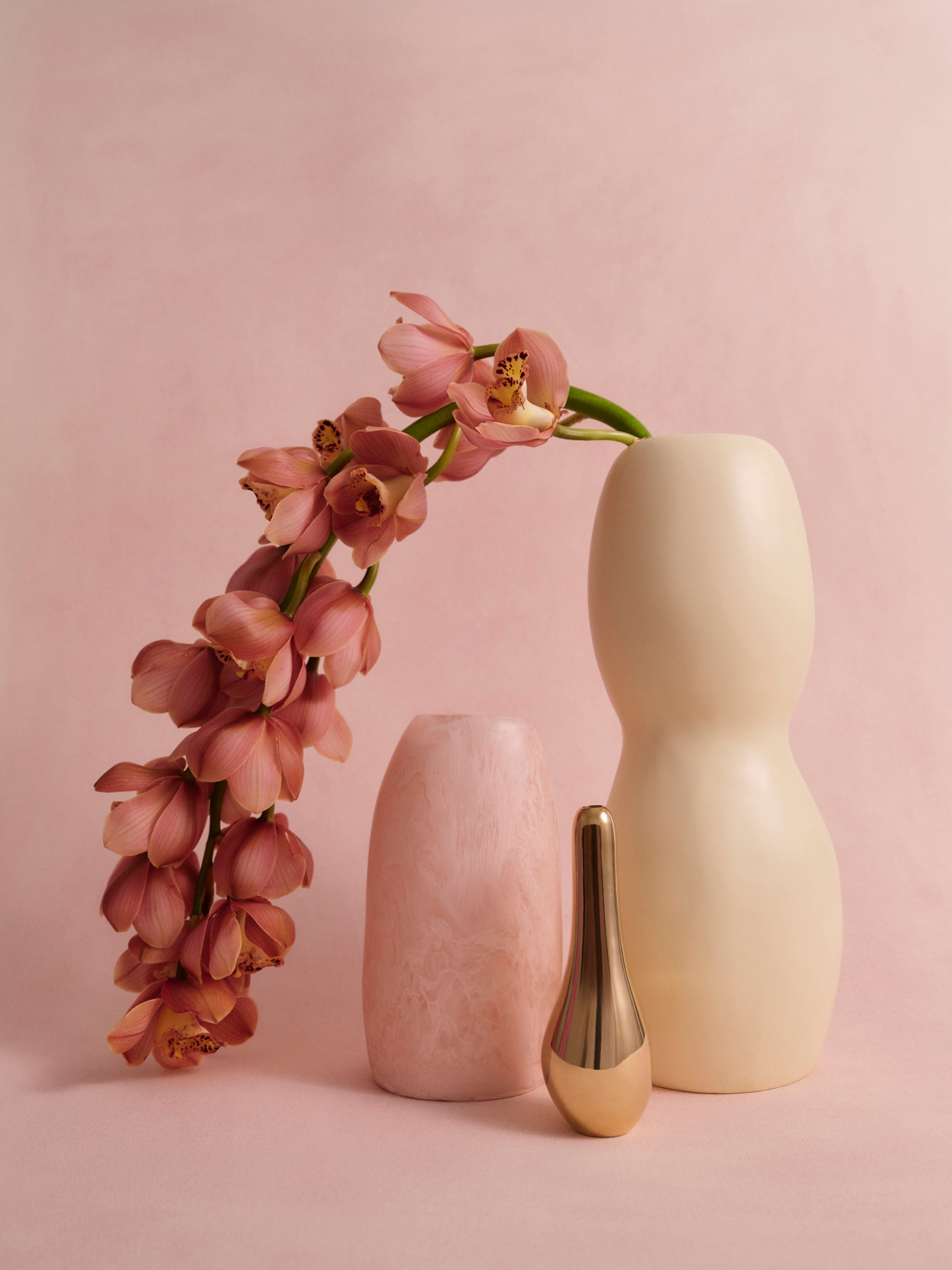 Dinosaur Designs cluster of resin and brass vases with floral display