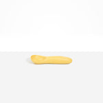 Dinosaur Designs Shell Gelato Scoop in Pollen — handcrafted marbled yellow resin ice cream scoop with deep rounded bowl and smooth cylindrical handle