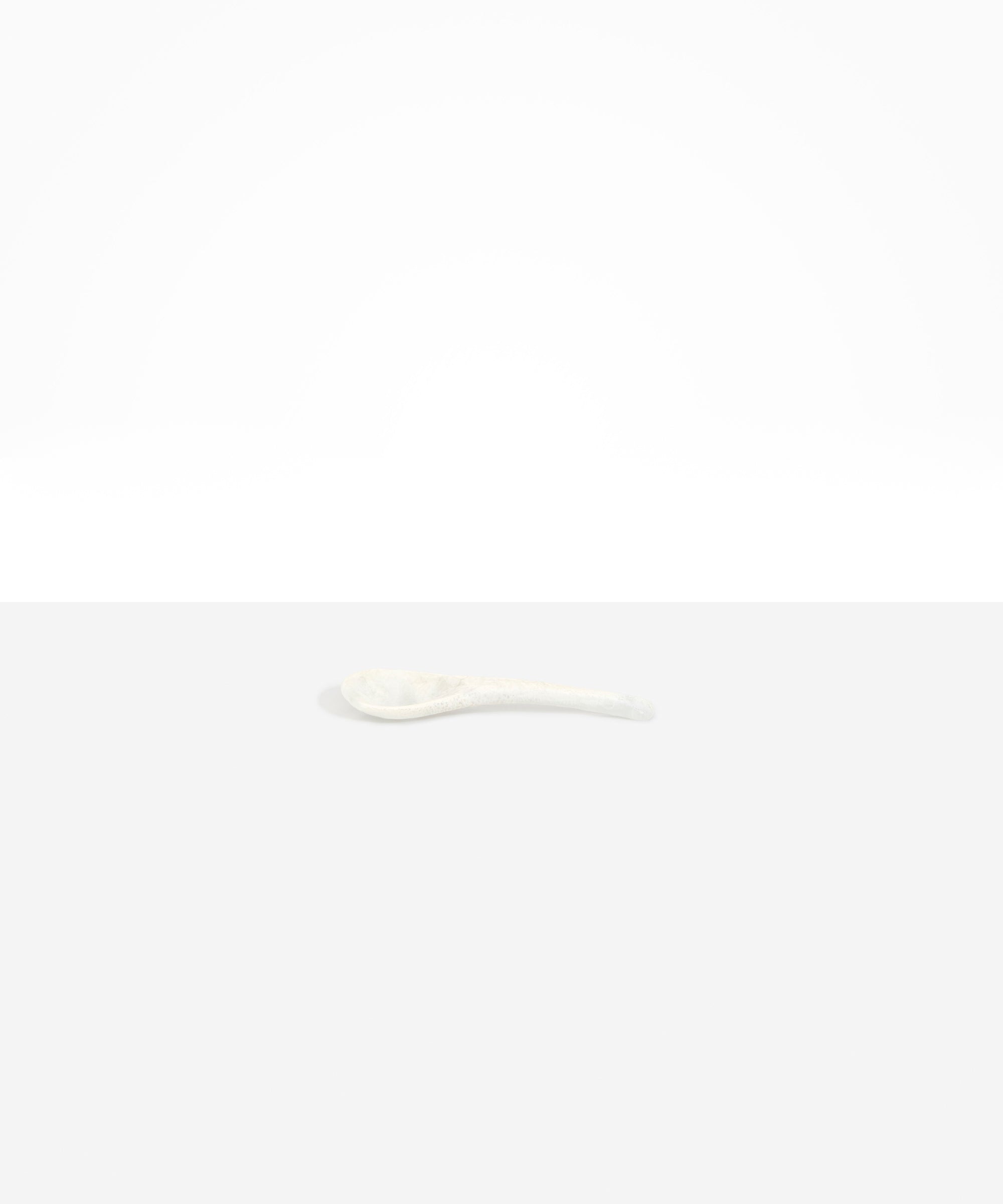 Dinosaur Designs Large Shell Spoon in Chalk Swirl — handcrafted marbled off-white resin spoon with slender tapered handle