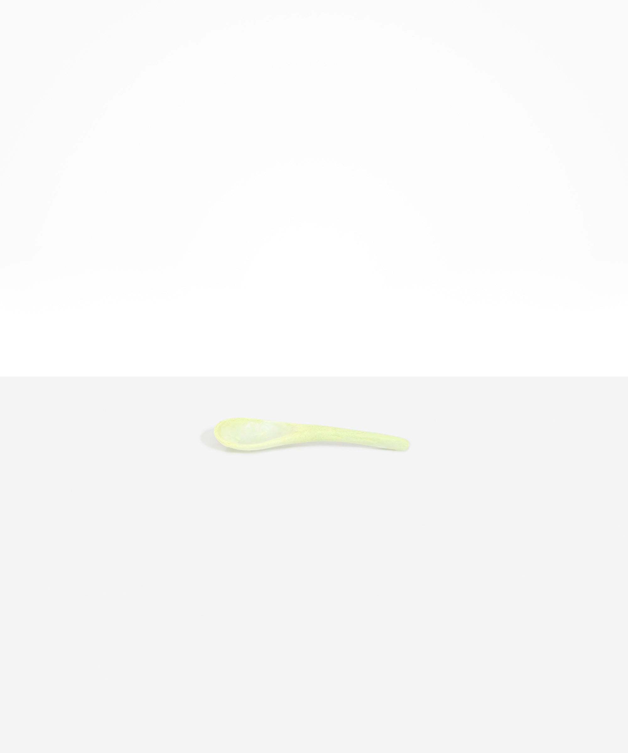 Dinosaur Designs Large Shell Spoon in Pistachio — handcrafted marbled pale green resin spoon with slender tapered handle