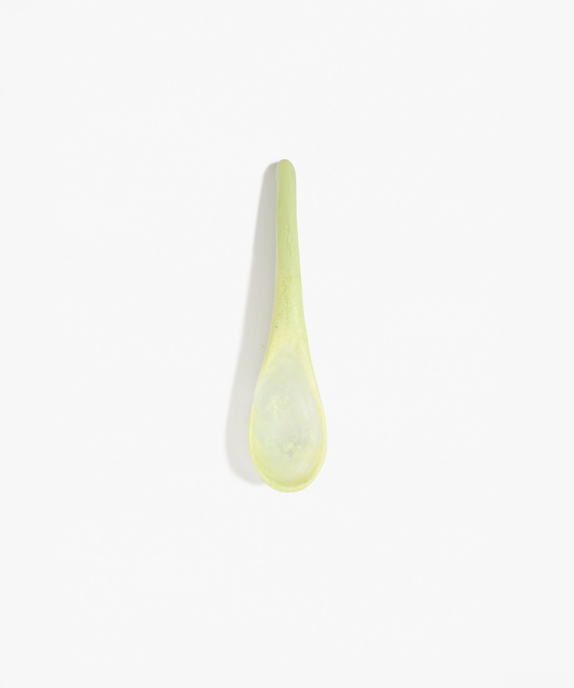 Dinosaur Designs Large Shell Spoon in Pistachio — handcrafted marbled pale green resin spoon with slender tapered handle