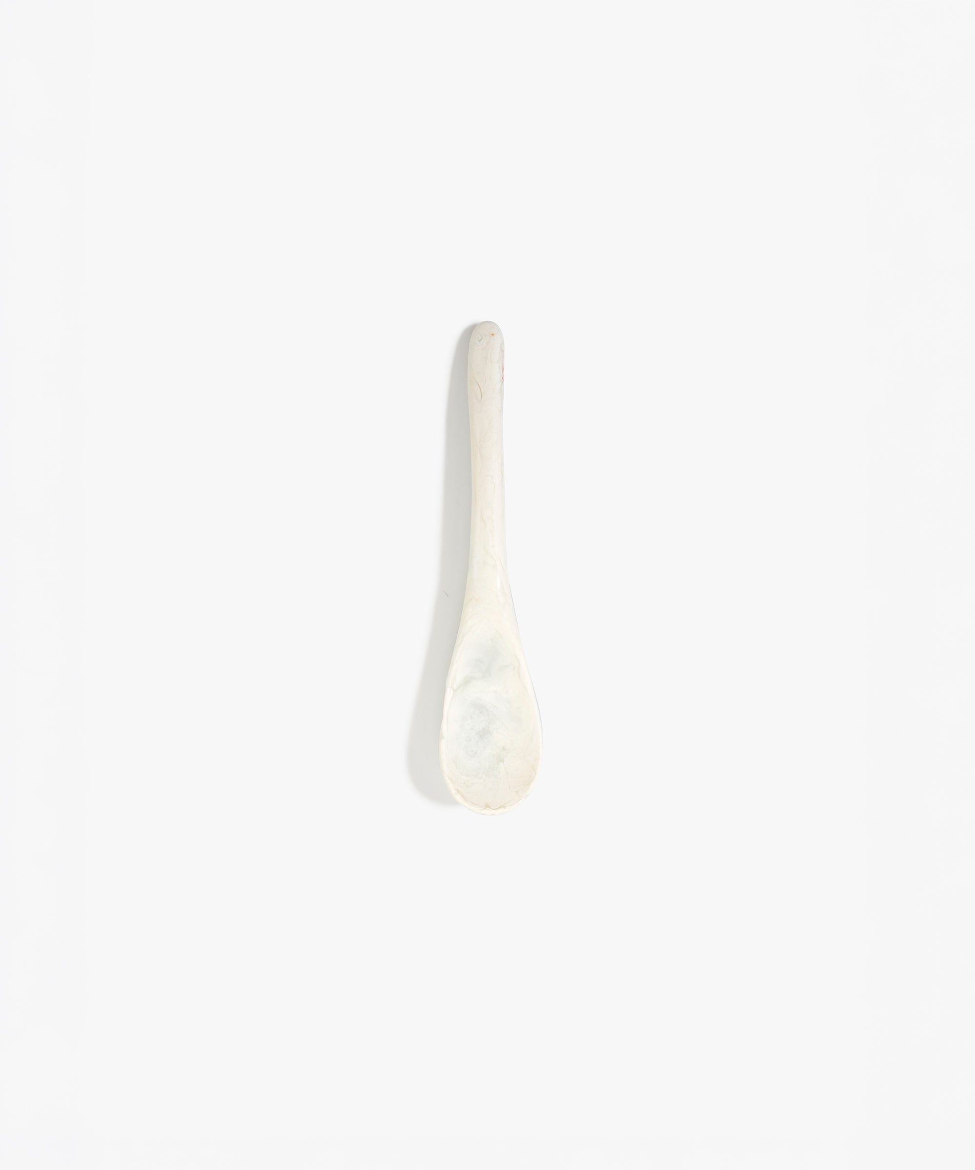 Dinosaur Designs Medium Shell Spoon in Chalk Swirl — handcrafted marbled off-white resin spoon with slender tapered handle