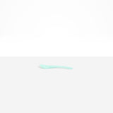 Dinosaur Designs Medium Shell Spoon in Mint — handcrafted marbled mint blue resin spoon with slender tapered handle