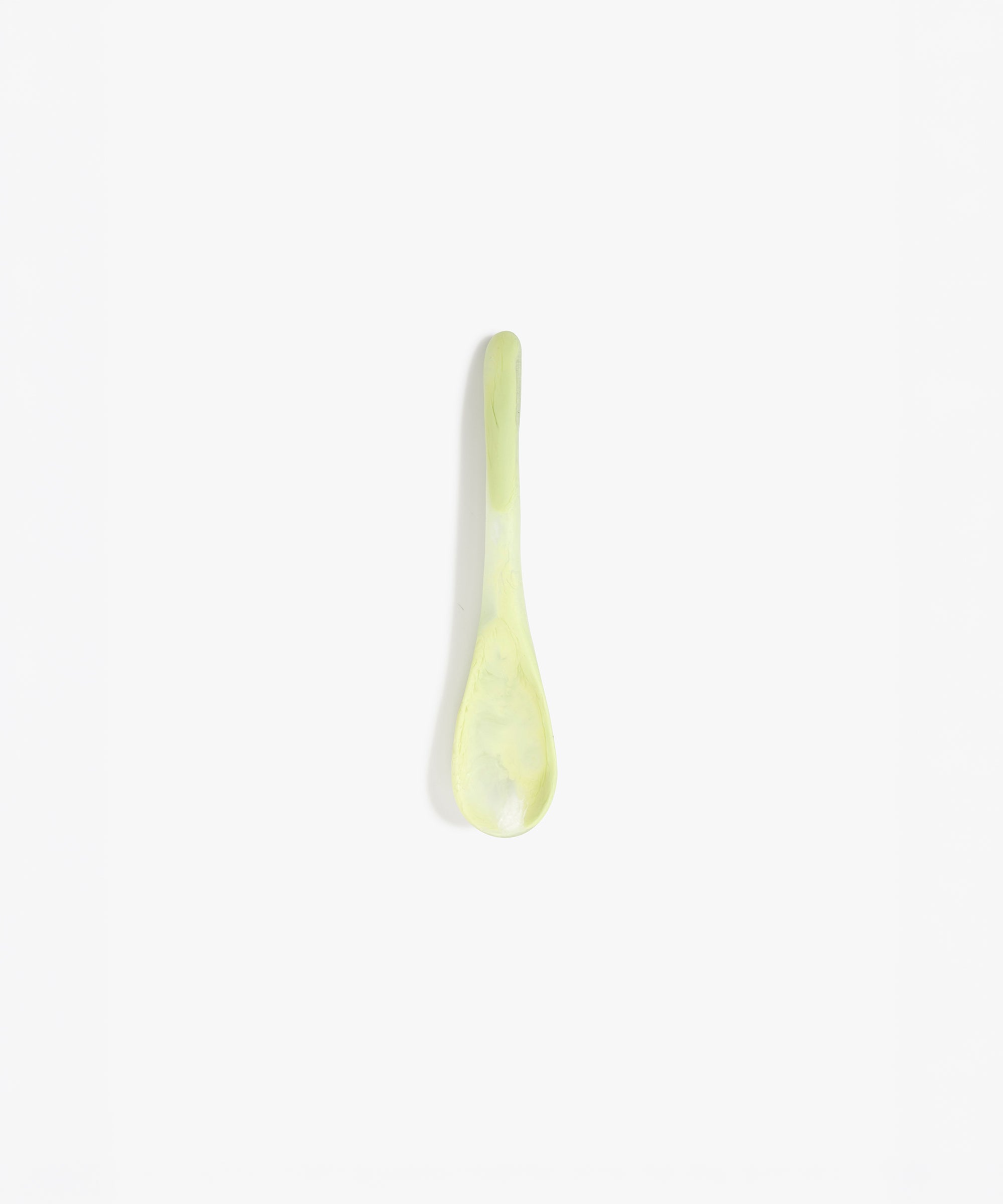 Dinosaur Designs Medium Shell Spoon in Pistachio — handcrafted marbled pale green resin spoon with slender tapered handle