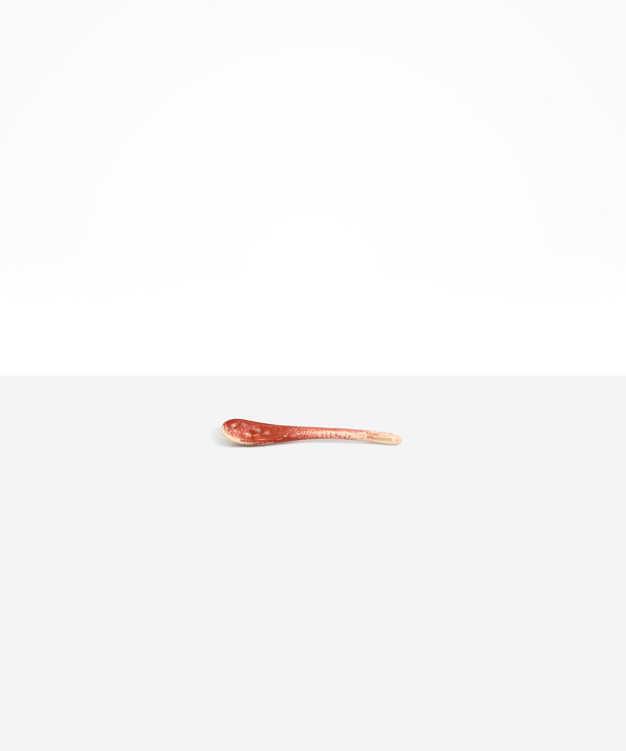 Dinosaur Designs Medium Shell Spoon in Rust — handcrafted marbled terracotta red and cream resin spoon with slender tapered handle
