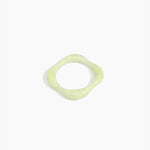Dinosaur Designs Petal Bangle in Pistachio — handmade marbled pastel green resin bangle with slim undulating organic form