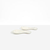 Dinosaur Designs Rock Servers in Chalk Swirl — handcrafted marbled off-white resin salad server set with rounded bulb handles, fork and spoon.