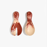 Dinosaur Designs Rock Servers in Rust — handcrafted marbled terracotta red and cream resin salad server set with rounded bulb handles, fork and spoon.
