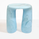 Dinosaur Designs Rock Tower Table in Pool — handcrafted marbled blue and clear resin side table with oval top and two chunky rounded legs