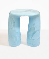 Dinosaur Designs Rock Tower Table in Pool — handcrafted marbled blue and clear resin side table with oval top and two chunky rounded legs..