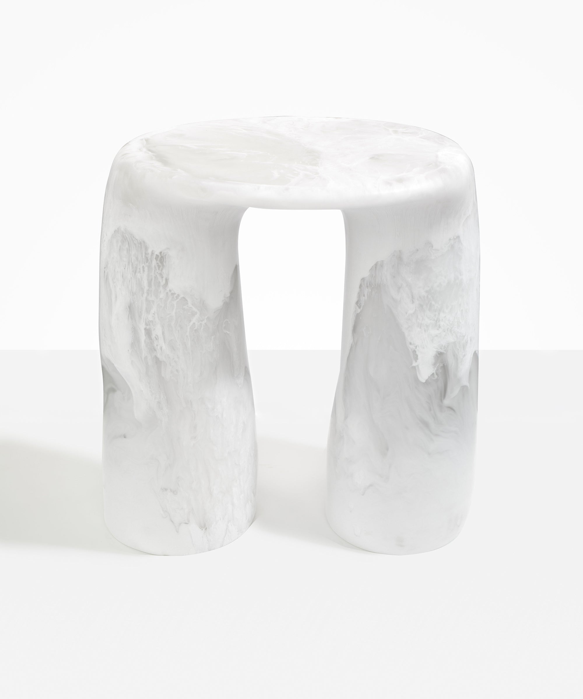 Dinosaur Designs  Rock Tower Table in Snow Swirl — handcrafted marbled white and clear resin side table with oval top and two chunky rounded legs