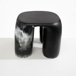 Dinosaur Designs 4-Leg Rock Tower Table in Black Marble — handcrafted marbled black and white resin side table with square top and four chunky rounded legs