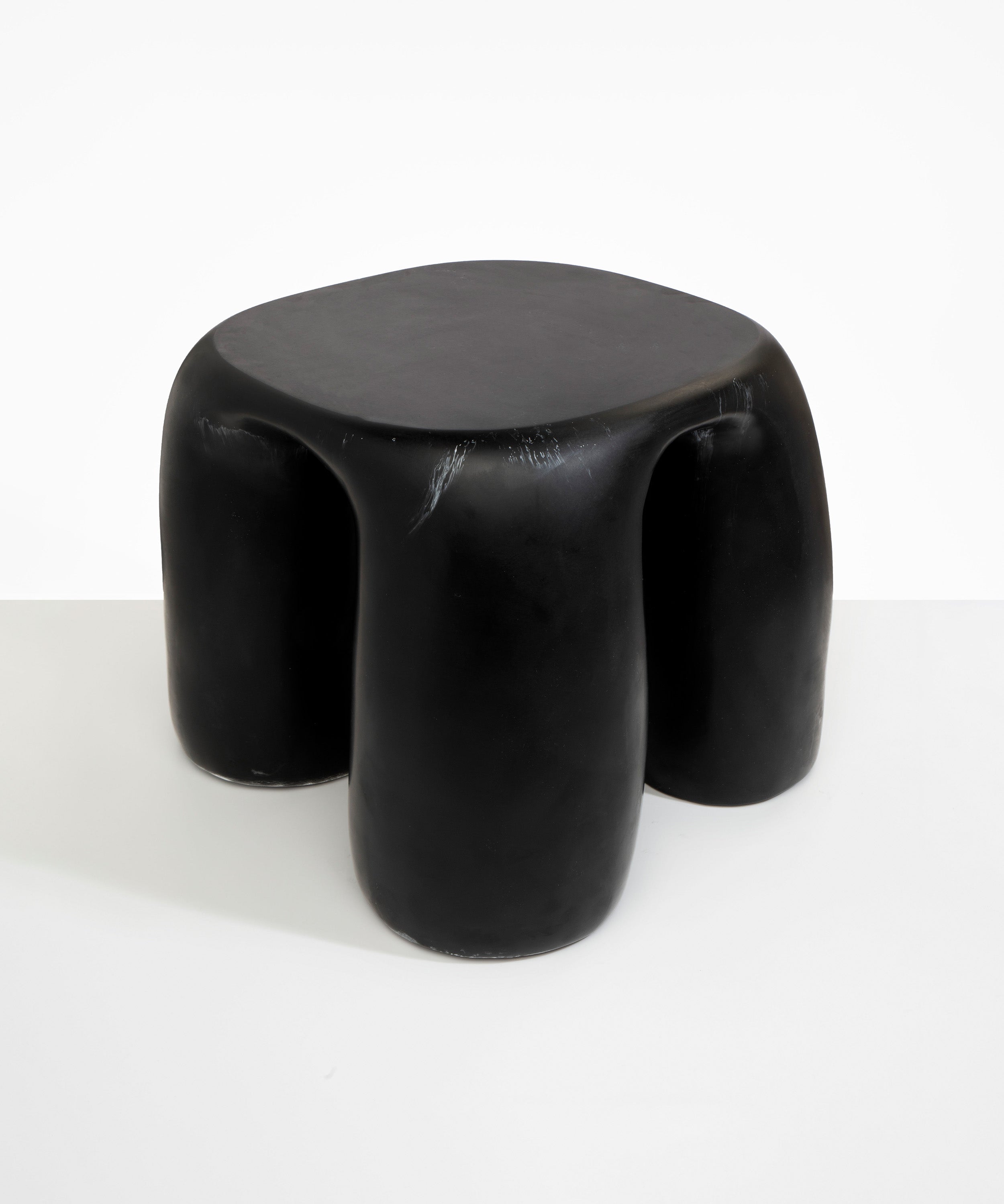 Dinosaur Designs 4-Leg Rock Tower Table in Black Marble — handcrafted marbled black and white resin side table with square top and four chunky rounded legs