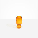 Dinosaur Designs Small Glass Rockpool Vase in Amber — handblown amber glass vase with rounded bulbous body and small spherical pedestal base