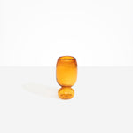 Dinosaur Designs Small Glass Rockpool Vase in Amber — handblown amber glass vase with rounded bulbous body and small spherical pedestal base