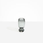 Dinosaur Designs Small Glass Rockpool Vase in Clear Black — handblown transparent black glass vase with rounded bulbous body and small spherical pedestal base