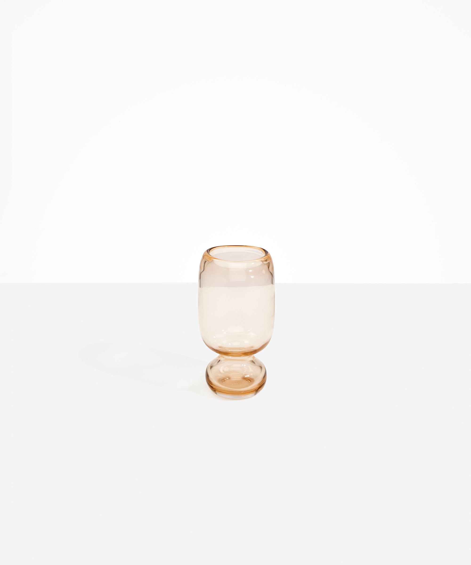Dinosaur Designs Small Glass Rockpool Vase in Clear Brown — handblown transparent brown glass vase with rounded bulbous body and small spherical pedestal base