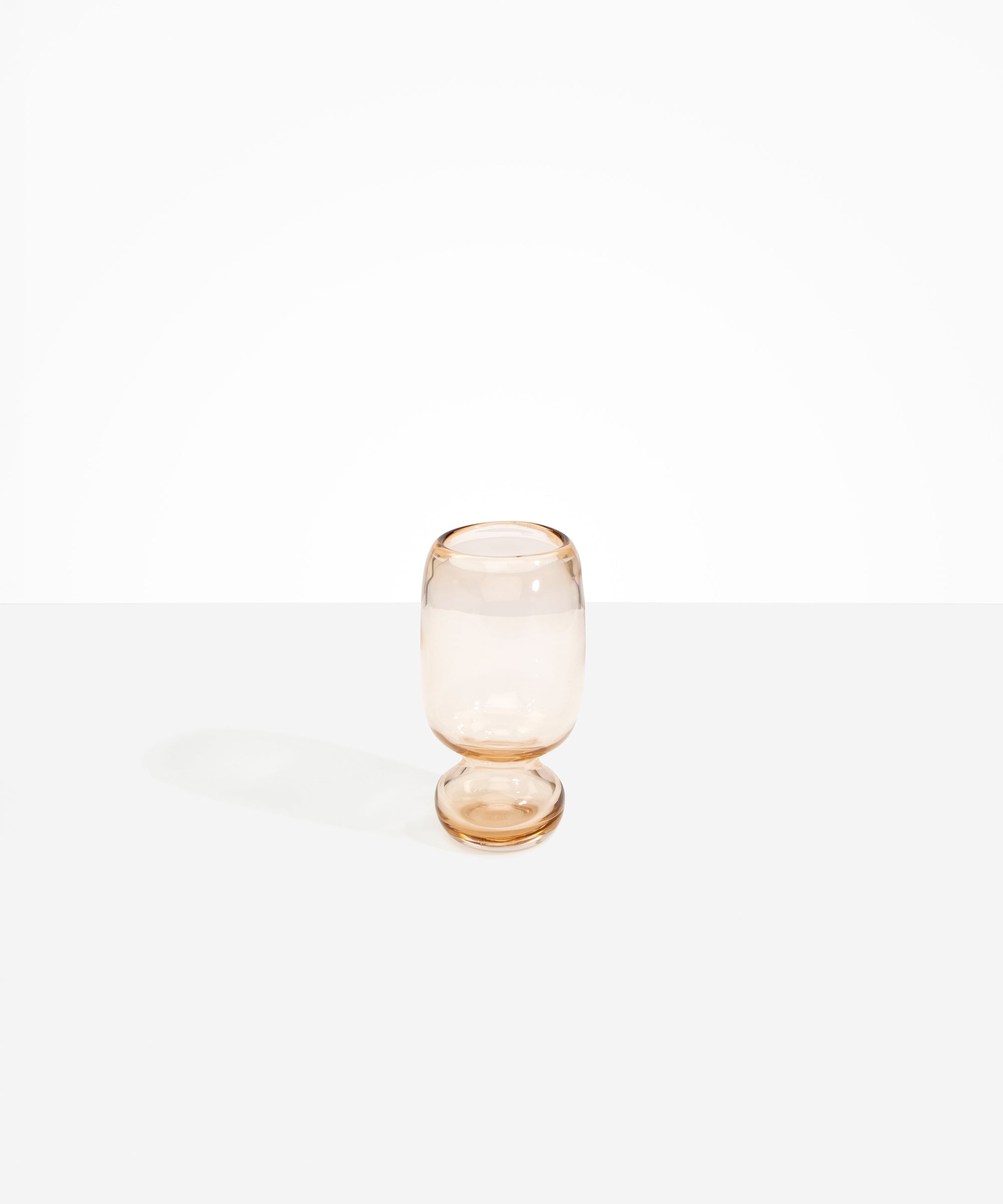 Dinosaur Designs Small Glass Rockpool Vase in Clear Brown — handblown transparent brown glass vase with rounded bulbous body and small spherical pedestal base
