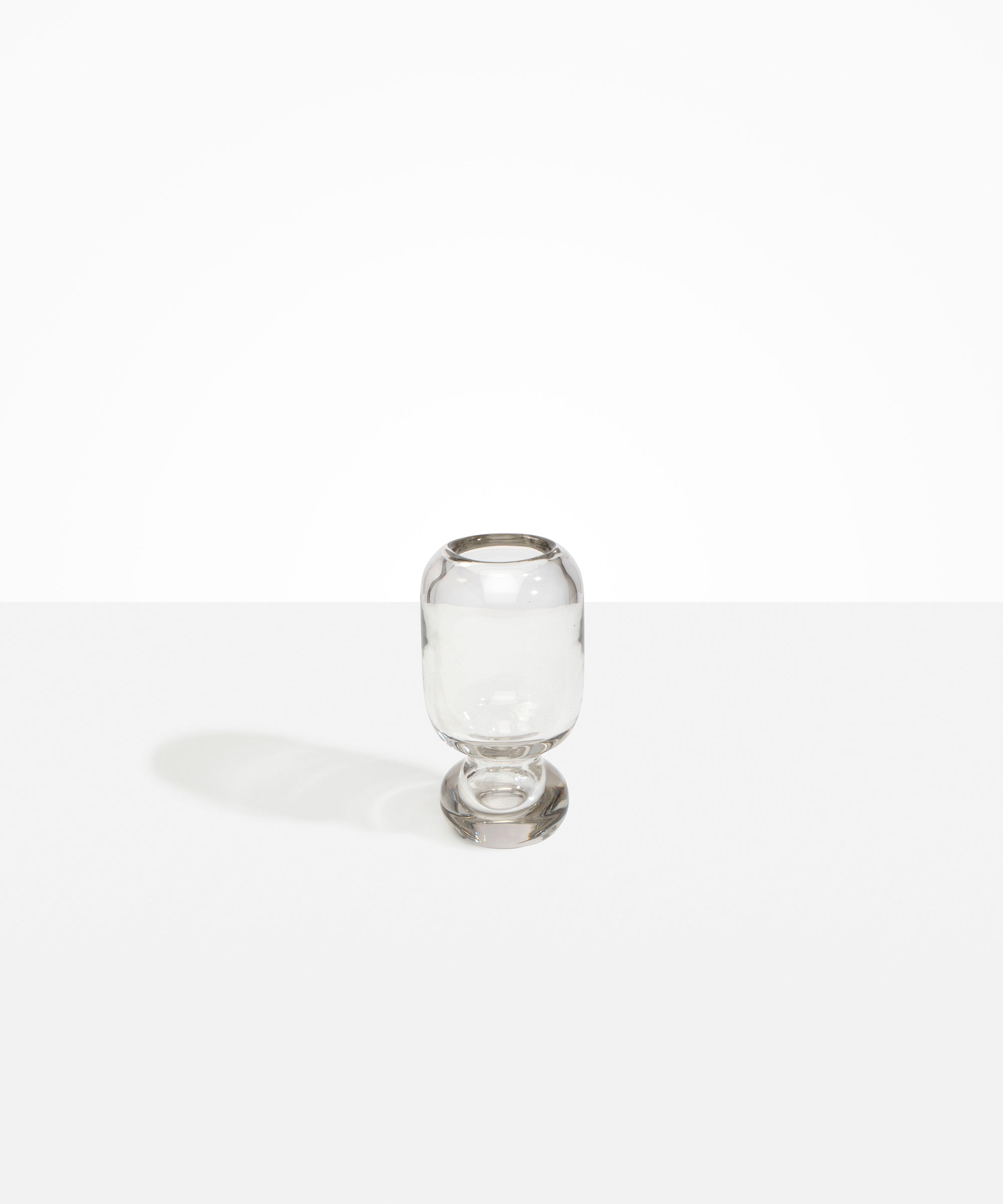 Dinosaur Designs Small Glass Rockpool Vase in Clear — handblown transparent glass vase with rounded bulbous body and small spherical pedestal base